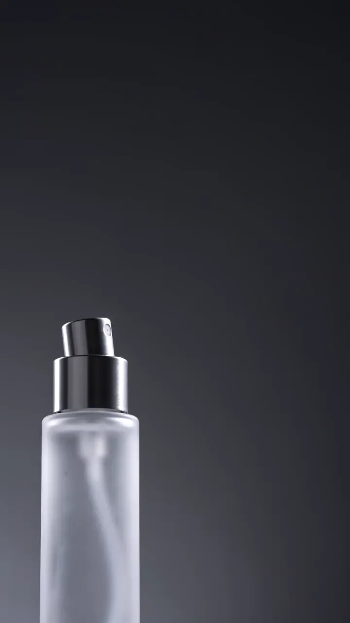 PLUME clip: mist bottle spraying cold white against the dark, close
